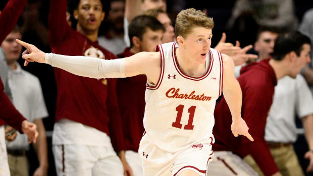 Charleston guard Ryan Larson celebrates a score